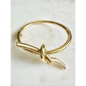 Sleek gold color tie the knot bangle bracelet